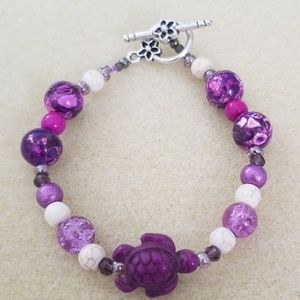 Handmade glass bead bracelet featuring sea turtle